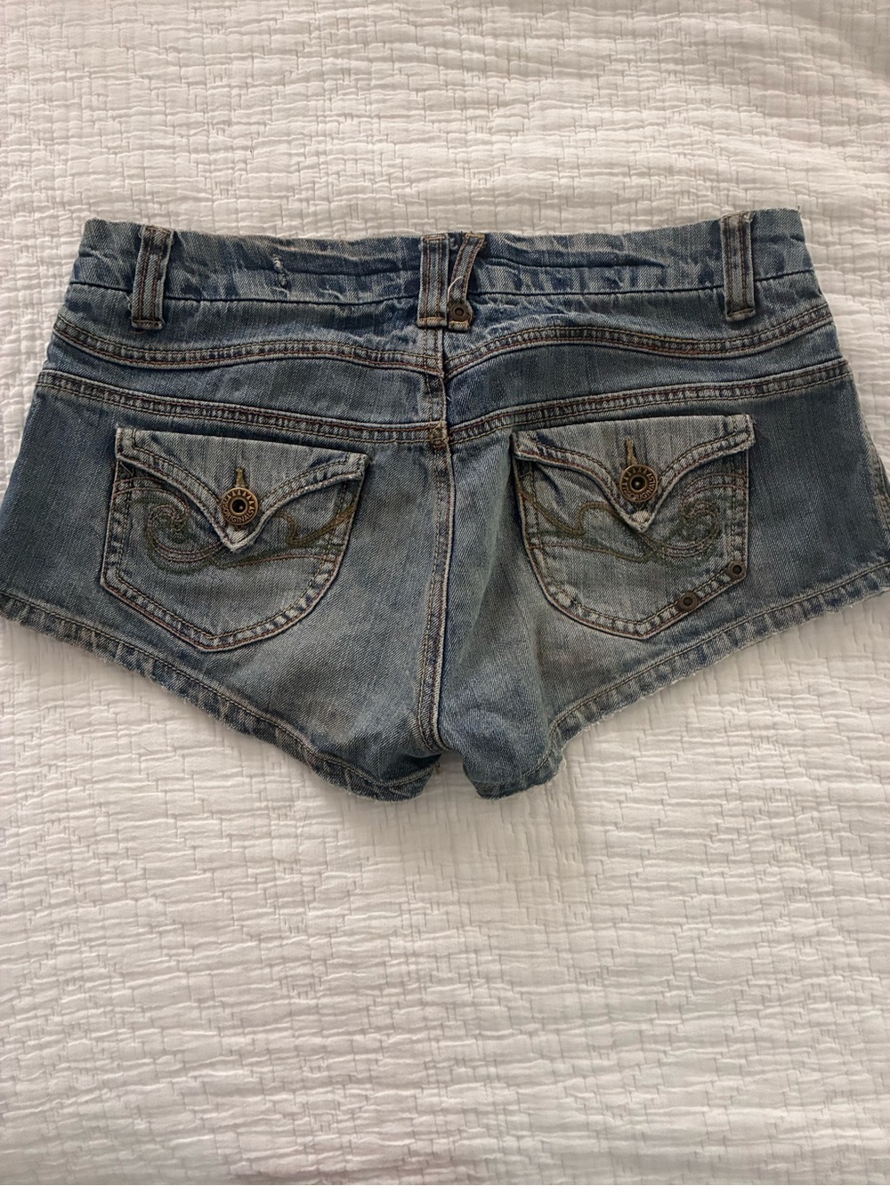 Extreme low rise….Embroidered Light Blue Denim Cutoff Shorts
